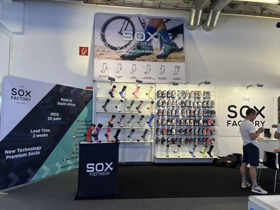 Eurobike Germany Custom Sock Showcase The Sox Factory's exhibition stand at the Eurobike Festival in Germany, showcasing our custom sock manufacturing and design capabilities to an international audience.